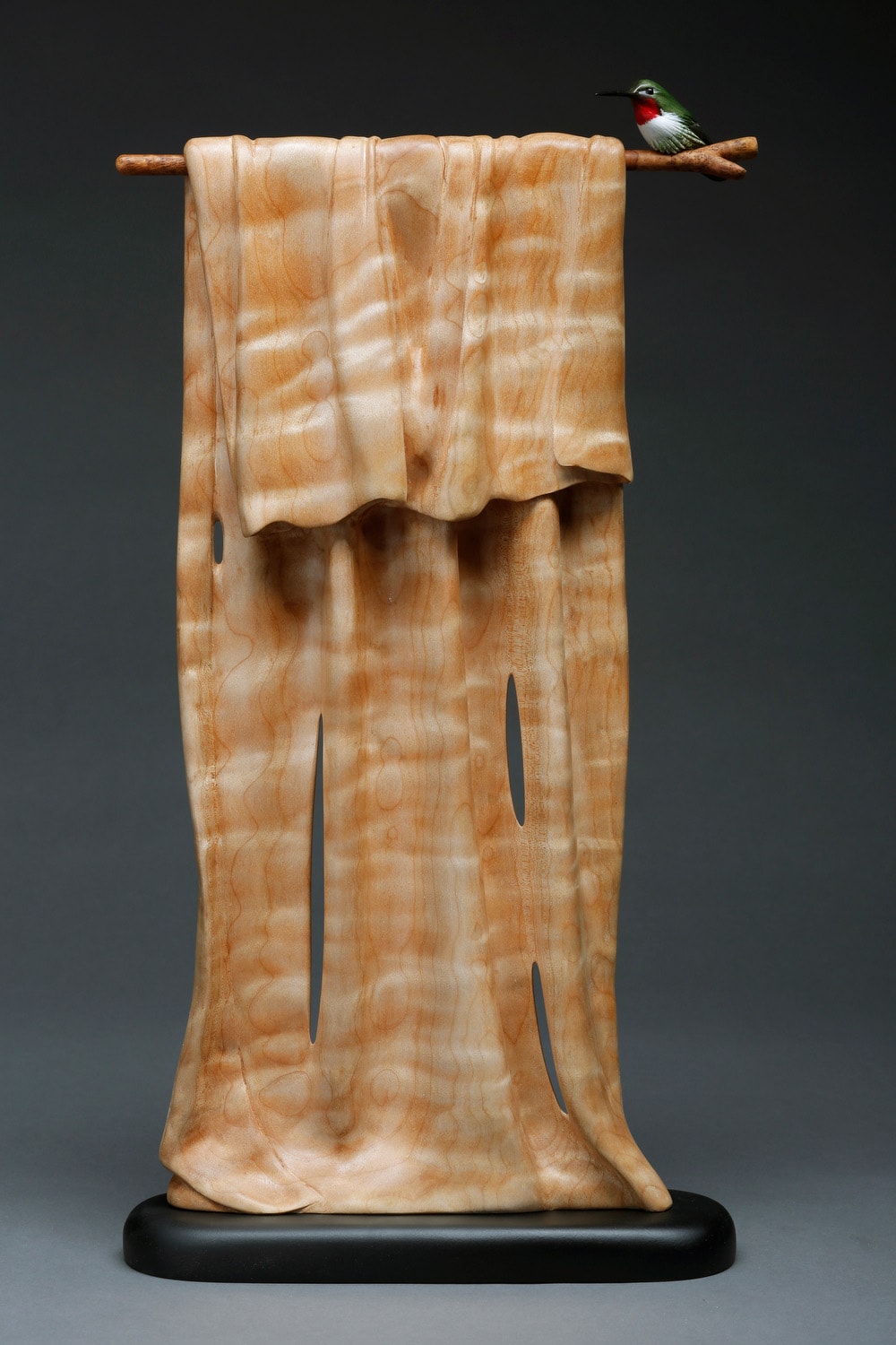 Hummingbird on vertical wood draped fabric sculpture in honey tones